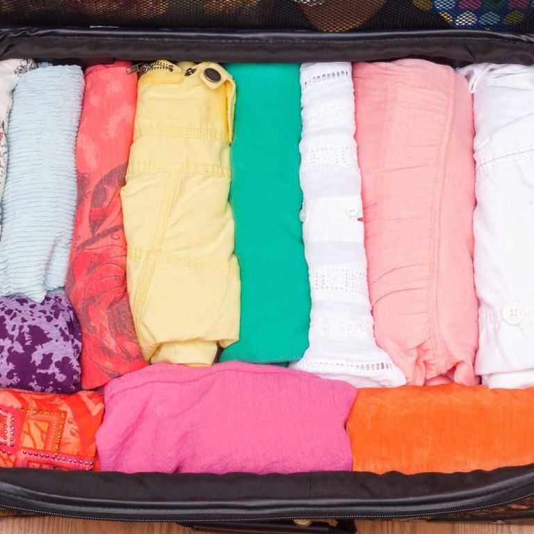How to Fit Clothing in a Suitcase — How to Travel With Only a Carry On